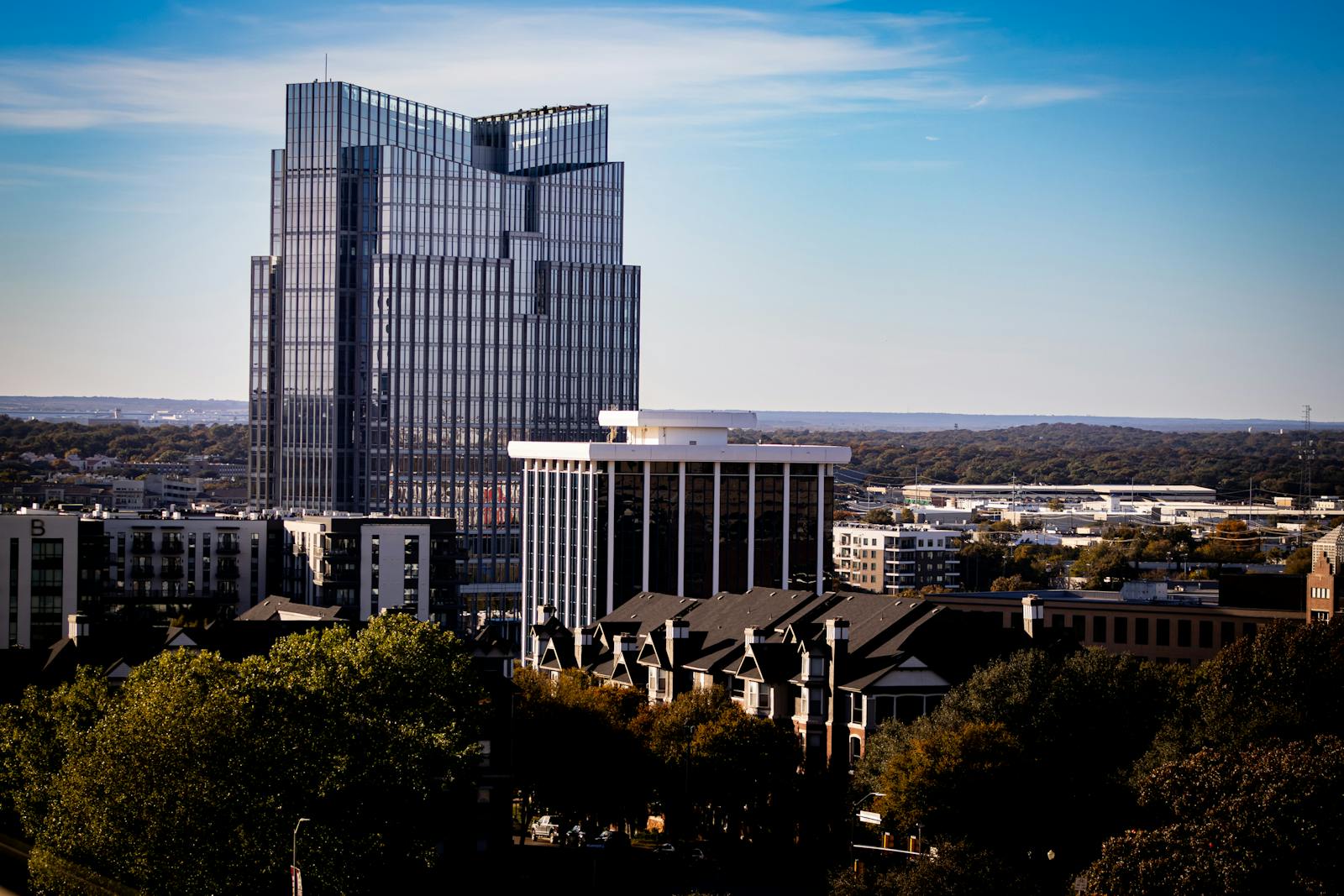 A view of Fort Worth modern skyline with the prominent Frost Tower under a clear blue sky.